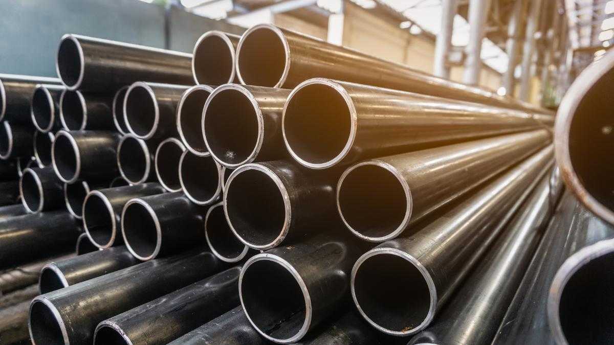 Steel pipes stacked up in a warehouse