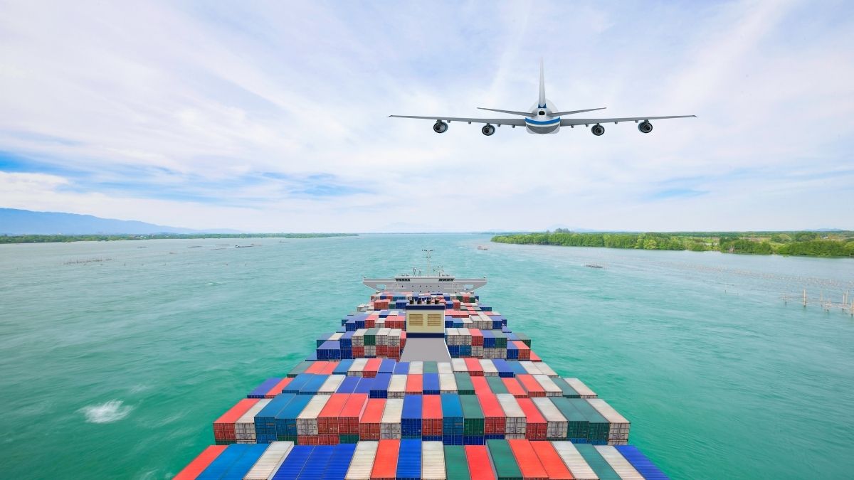 Ocean shipping containers on a ship with air freight plane in the sky above