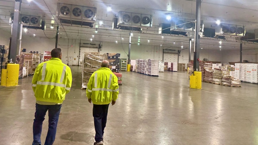 Workers walking through a warehouse